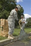 Airmen volunteer to cut grass